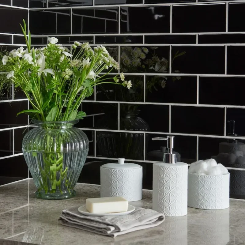 Black rectangle ceramic tile shown on a kitchen wall