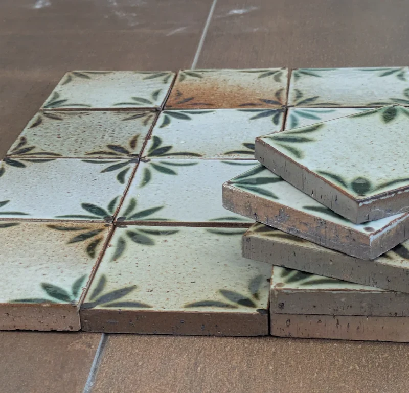 Hand-painted Seville glazed terracotta tile showing the natural variation in colour