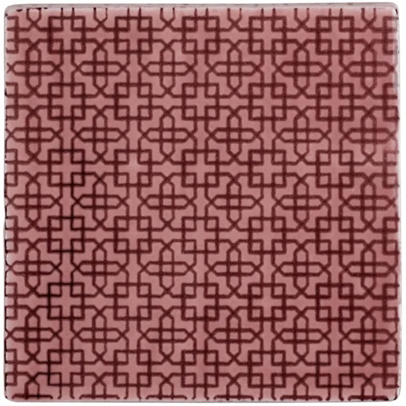 Manoir Fleur Tayberry decorative wall tile with Art Deco starburst pattern in berry red on a pink background