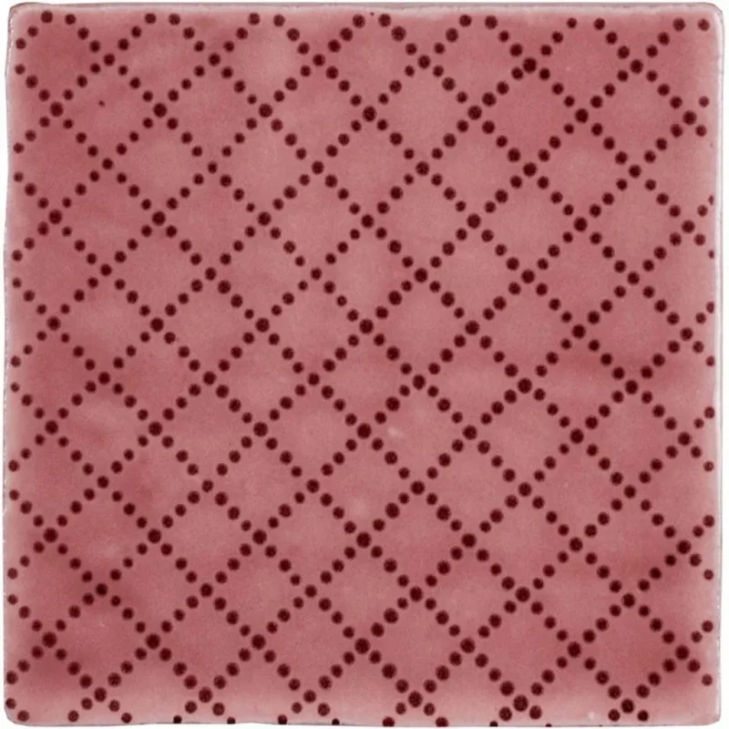 Manoir Trellis Tayberry decorative wall tile with dotted diamond pattern in berry red on a soft pink background