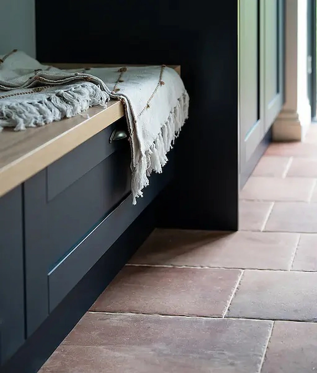 Brewhouse porcelain 45x22.5cm rectangle tile in earthy tones shown as a close up kitchen floor