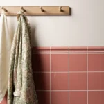 Duchy pink field tile shown on a wall with border tile
