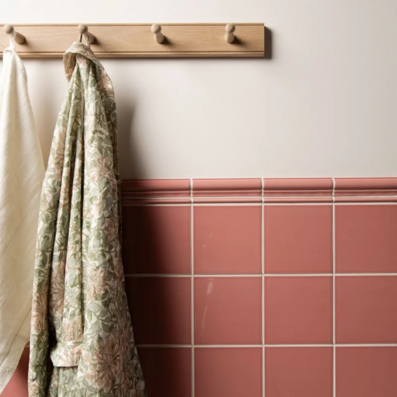 Duchy pink field tile shown on a wall with border tile