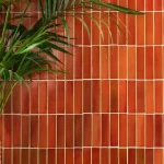 Stone Glaze Imperial Red 5x20cm ceramic tiles laid in a vertical brick bond with a bold, glossy red finish