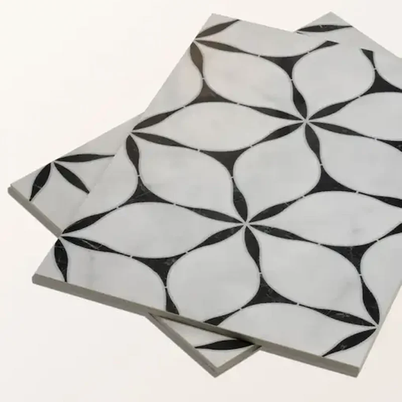Byzantine Elysium porcelain tile in a black and white geometric petal pattern, shown in an angled stack