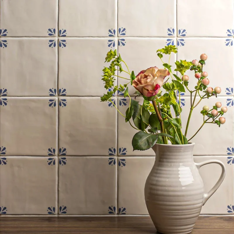 Classic Delft Cornelia wall tiles in cream with blue pattern, artisan glazed ceramic splashback for country kitchen interiors