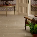Wychwood Porcelain floor tiles in a warm beige tone, styled in a classic hallway with traditional furniture.