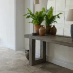 Versailles Marble Brun Honed 45.7x45.7cm tiles in a hallway with a rustic console table and indoor plants