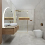 Abstract Sand large-format porcelain tiles with a concrete-effect finish in a beige tone, shown on bathroom walls and floors.