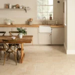Hartland Abbey 60x60 porcelain tiles laid in a kitchen, showing a soft stone look with slight variation and a matt finish.