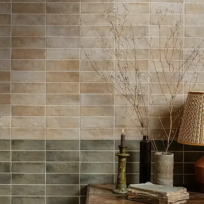 Oasis Veloute Ceramic Sage wall tiles laid in a horizontal pattern with soft tonal variation, blending sage and sand shades in a warm, natural interior.