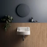 Bellever Alder slatted wood-effect tile fitted as a bathroom wall feature behind a wall-mounted basin