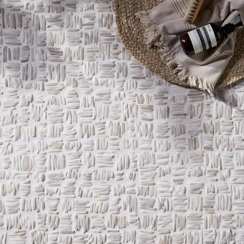 Enso Mosaic Organic Basketweave tile close-up showing textured neutral stone pattern with woven effect detail