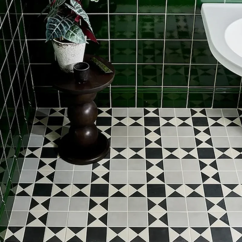 Olive green victorian style skirting tile shown on a bathroom wall with coordonating field tile