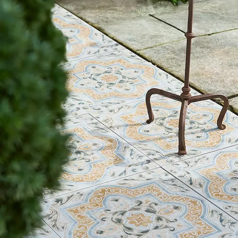 Tapestry Porcelain Paving Textured Arabic tile with a detailed vintage-style pattern in warm beige, soft grey, and charcoal tones.