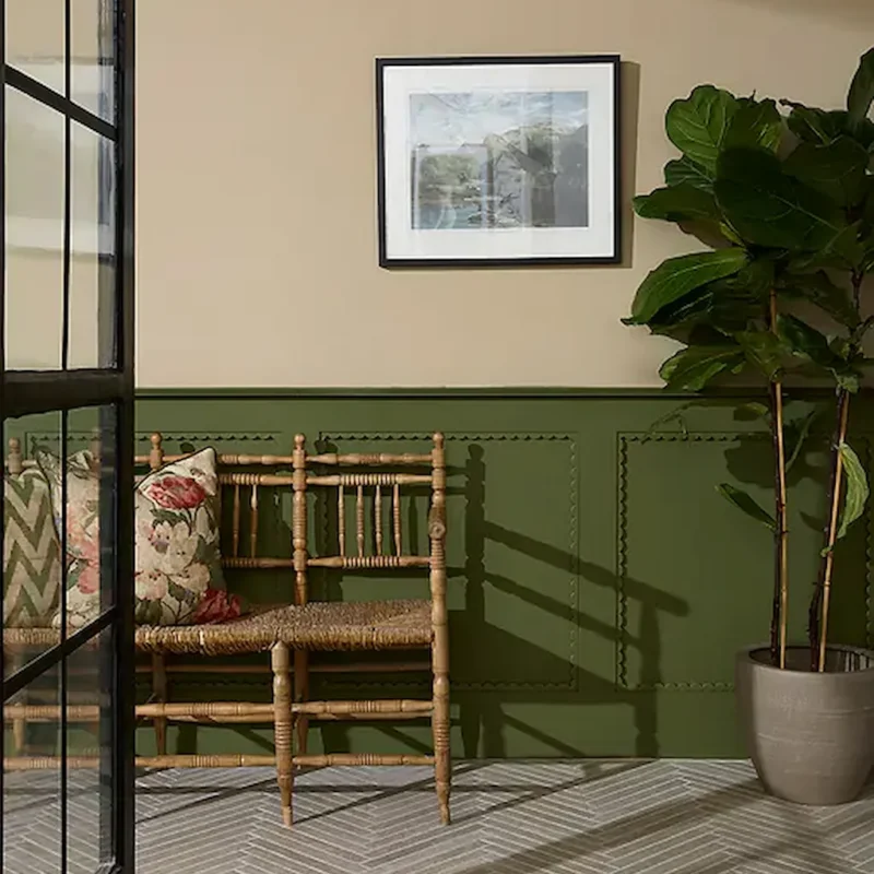 Abbey Porcelain Parquet Blend porcelain tiles by Ca' Pietra laid in a herringbone pattern in a hallway with green wall panelling.