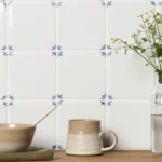 Delft White Naarden tiles used on a kitchen wall, showing the repeating blue corner pattern