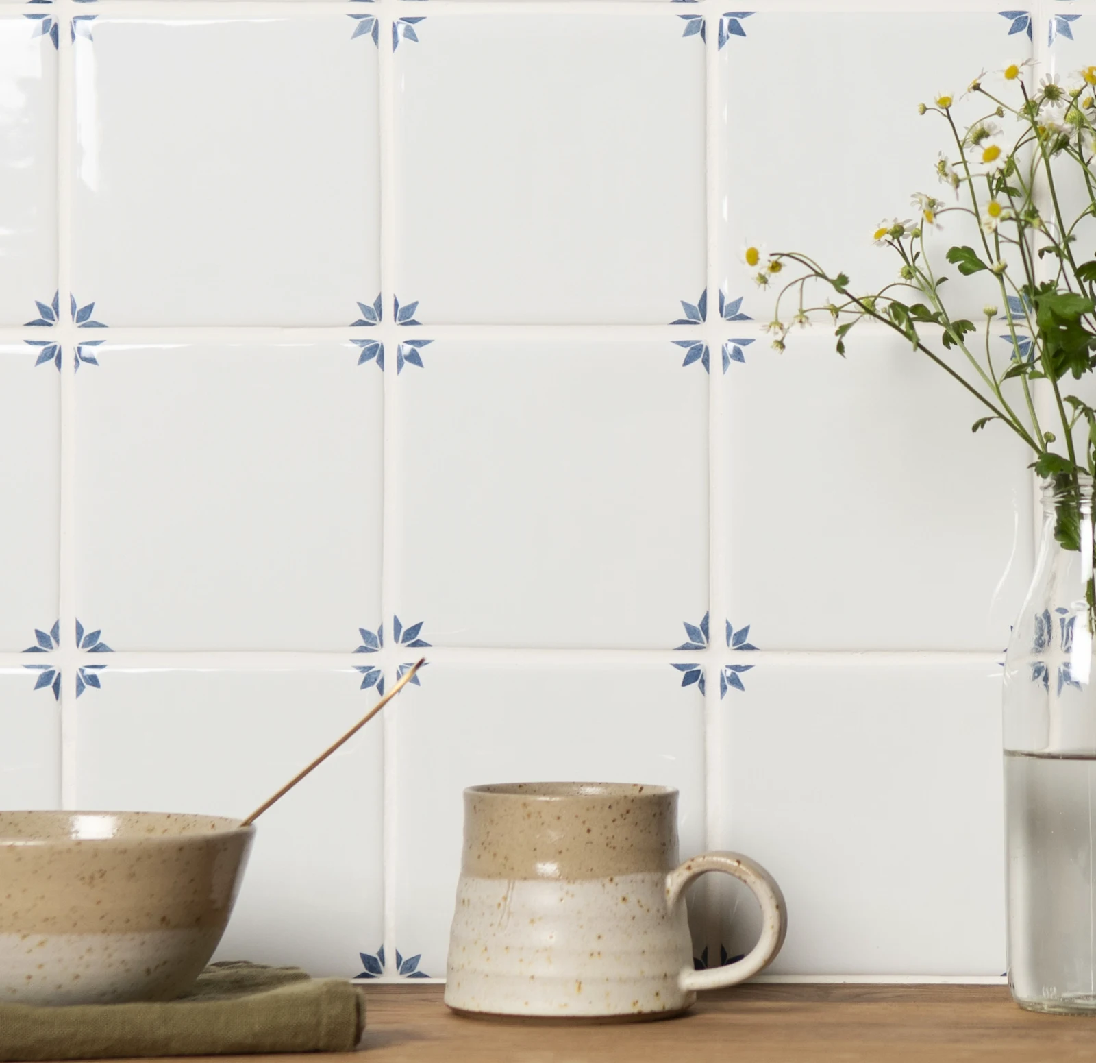 Delft White Naarden tiles used on a kitchen wall, showing the repeating blue corner pattern